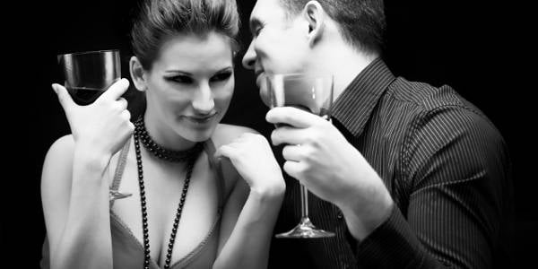 Young couple drinking wine and having fun