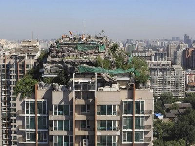 people-build-houses-on-top-of-apartment-buildings