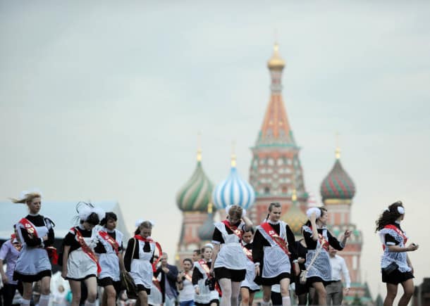 High-school graduates celebrate the last day of their classes on Red Square in Moscow on May 25, 2011. Russian teenagers celebrated the end of their studies across the country. AFP PHOTO / NATALIA KOLESNIKOVA (Photo credit should read NATALIA KOLESNIKOVA/AFP/Getty Images)