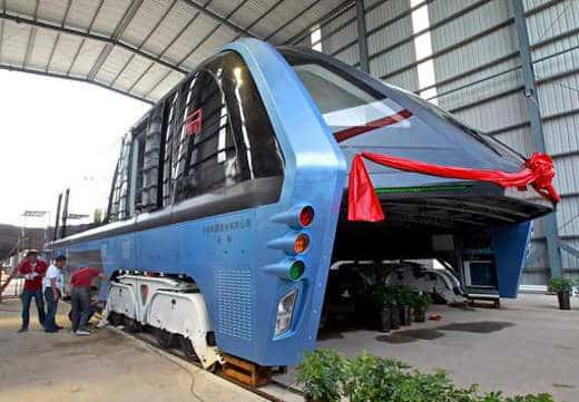 epa05456154 A picture made available 05 August 2016 shows a Transit Elevated Bus (TEB) parked in a garage in Qinhuangdao City, Hebei Province, China, 03 August 2016. The TEB, which is estimated at 2 meters high, 21 meters long and 7 meters wide, was first introduced through a mini-model at the 19th China Beijing International High-Tech Expo in May. It is estimated to be able to carry 300 passengers. EPA/STRINGER CHINA OUT
